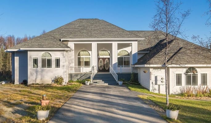 Exterior view of a senior living facility with broad steps