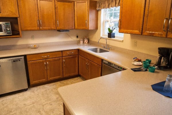 Bright kitchen with wooden cabinets and modern appliances