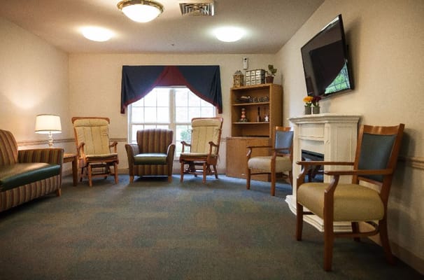 Cozy common area with seating and a TV