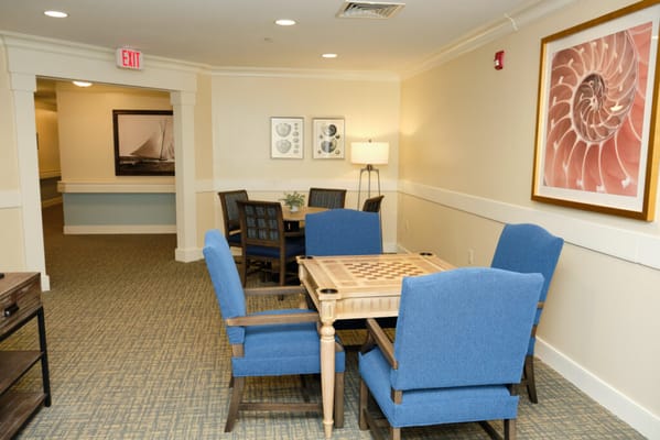Bright common area with seating and game table