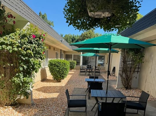Serene courtyard with tables and umbrellas