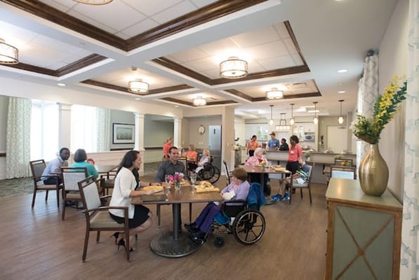 Residents enjoying meals in a dining area