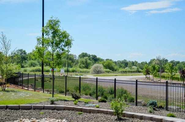 View of an outdoor landscaped area and fence