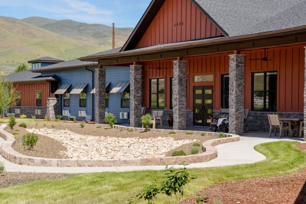 Outdoor view of a senior living facility with pathways