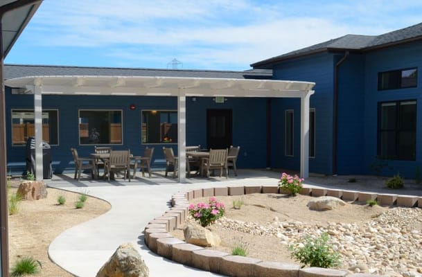 Outdoor seating area with patio and garden