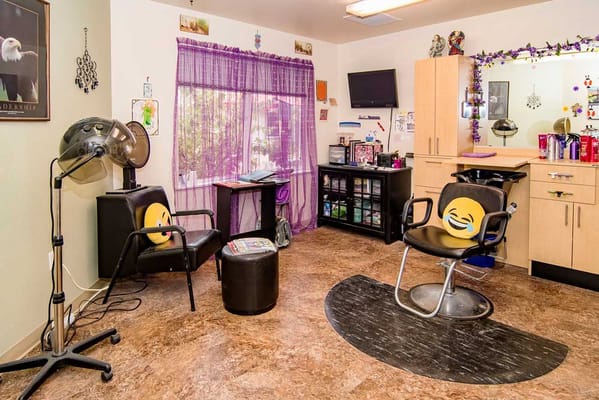 Interior view of a salon with styling chairs