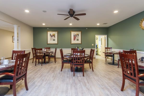 Dining area with wooden tables and chairs