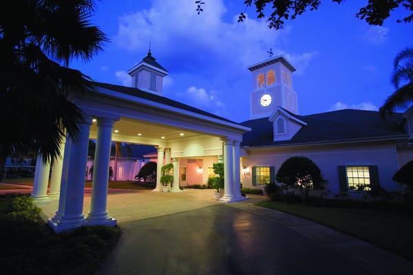 Elegant entrance of a senior living facility at dusk