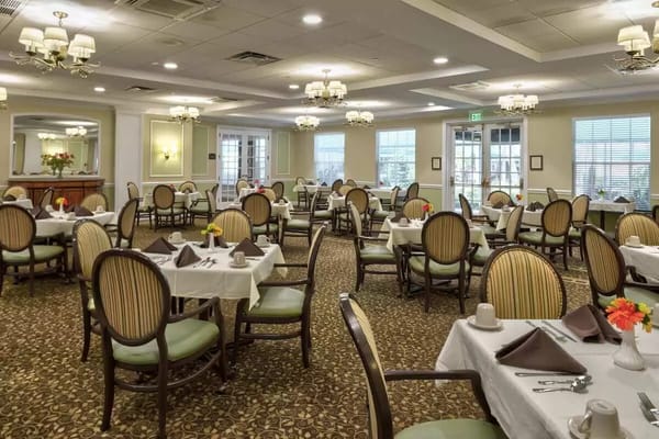 Elegant dining room setup with tables and chairs