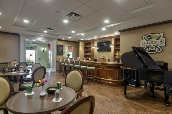 Interior view of a cozy lounge area with a piano