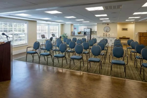 Empty activity room with chairs arranged in rows