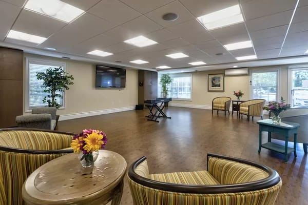Bright common area with seating and natural light
