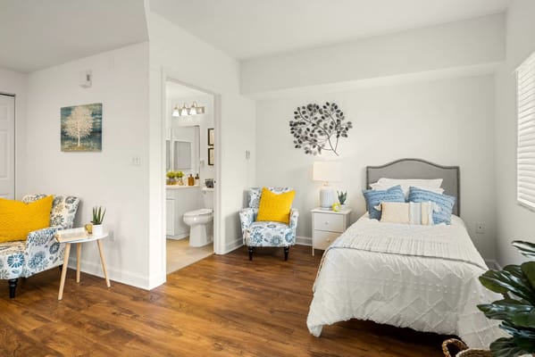 Brightly decorated resident room with cozy furnishings
