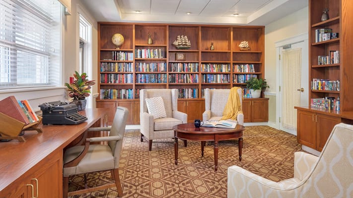 Cozy interior library with seating and bookshelves