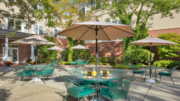 Outdoor patio area with tables and refreshments