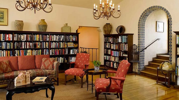 Cozy library with bookshelves and comfortable seating