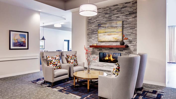 Cozy common area with seating and a fireplace