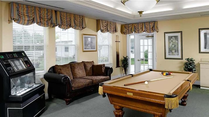 Interior common area with a pool table and seating
