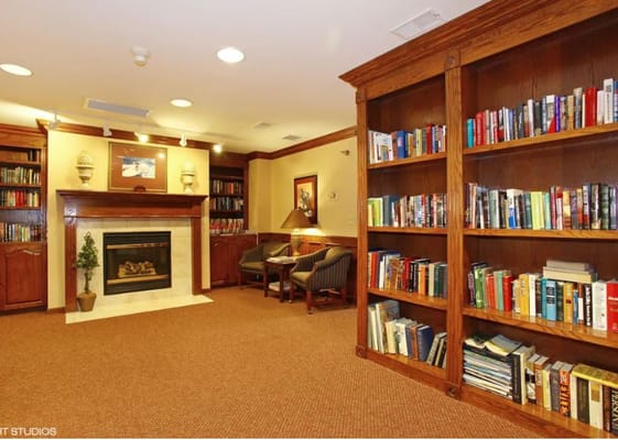 Cozy common area with bookshelves and seating