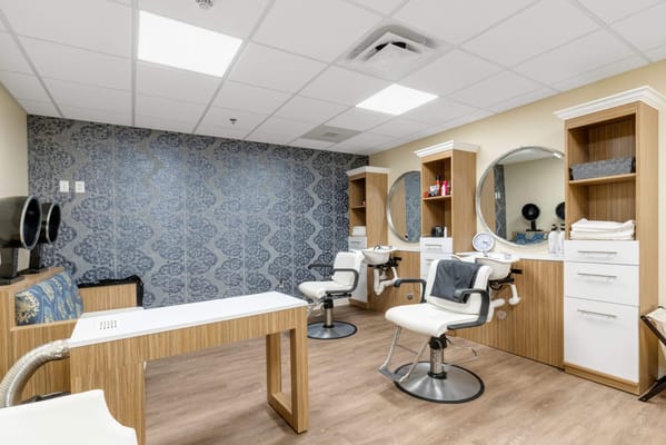 Beauty salon interior with modern styling stations
