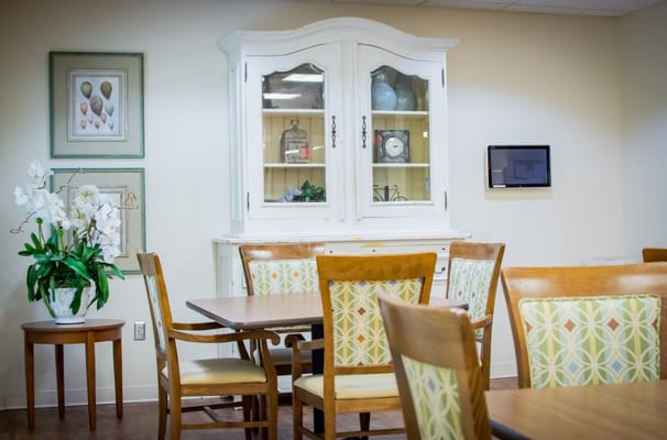 Interior common area with dining furniture and decor