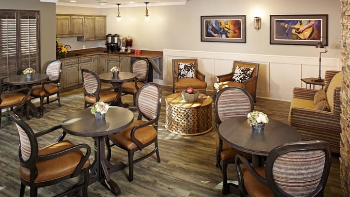 Bright common area with seating and floral decorations