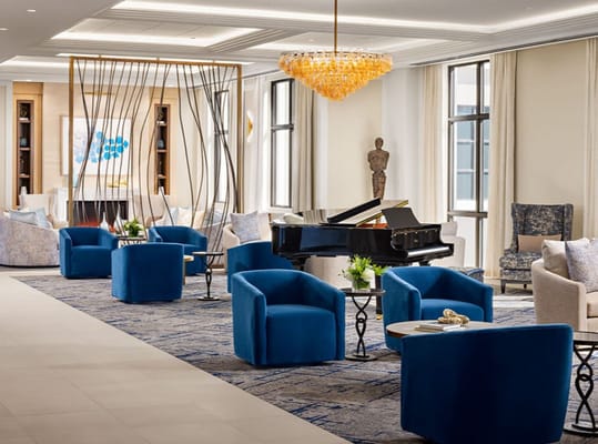 Elegant interior lounge area with seating and piano