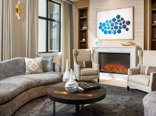 Interior lounge area with comfortable seating and fireplace