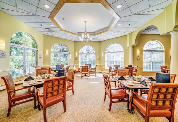 Bright dining room with tables set for a meal