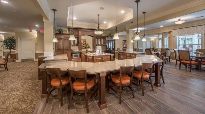 Bright and spacious common area with kitchen and seating