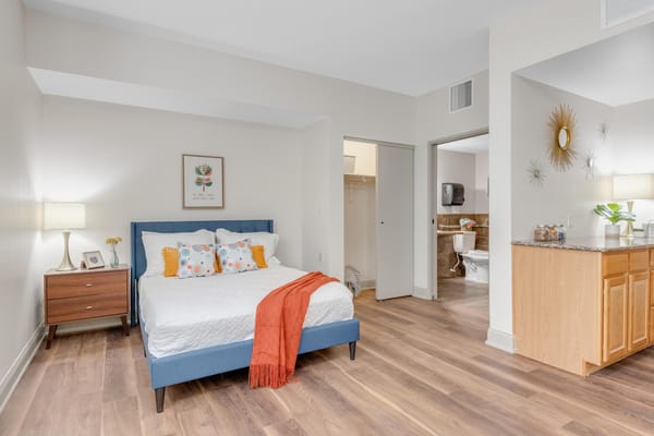 Brightly lit private resident room with modern decor