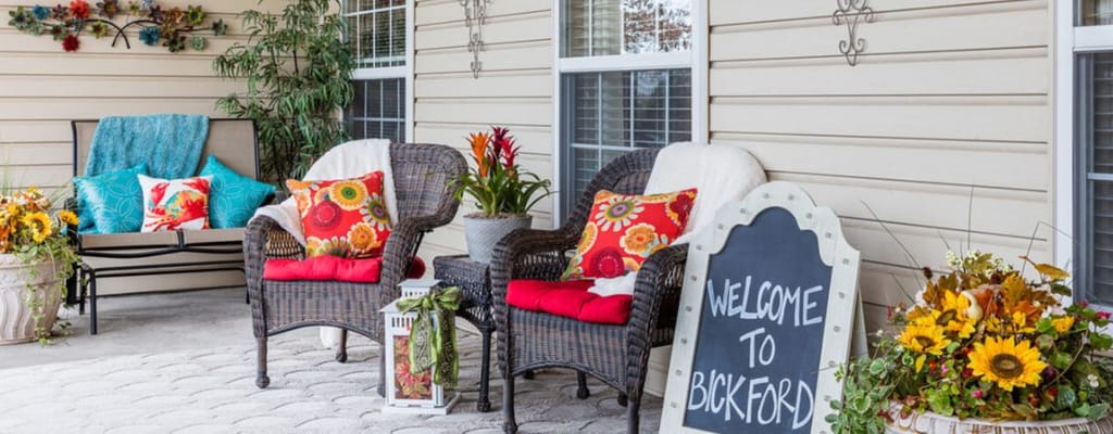 Charming outdoor seating area with welcome sign