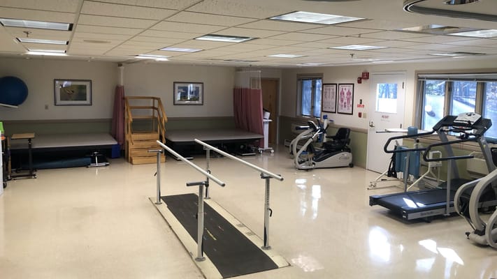 Interior view of a therapy room with exercise equipment