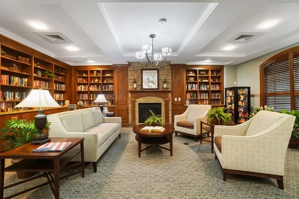 Cozy library area with comfortable seating and bookshelves