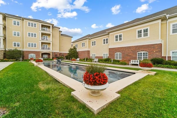 Lush garden area with water feature and seating