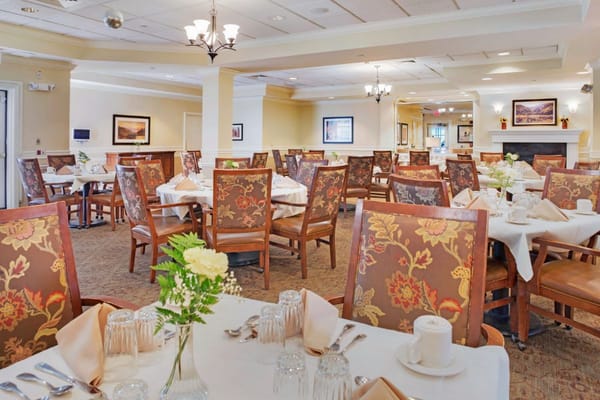 Bright dining room with floral tables and decor