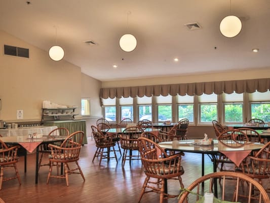 Bright dining area with tables and chairs