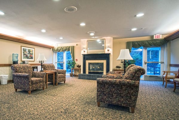 Interior common area with seating and fireplace