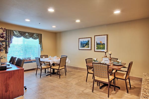 Bright dining area with tables and chairs