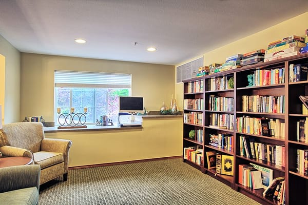Cozy common area with bookshelves and seating
