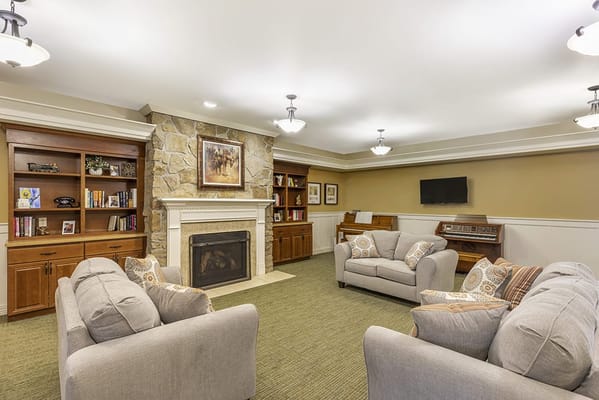 Cozy common area with seating and bookshelves