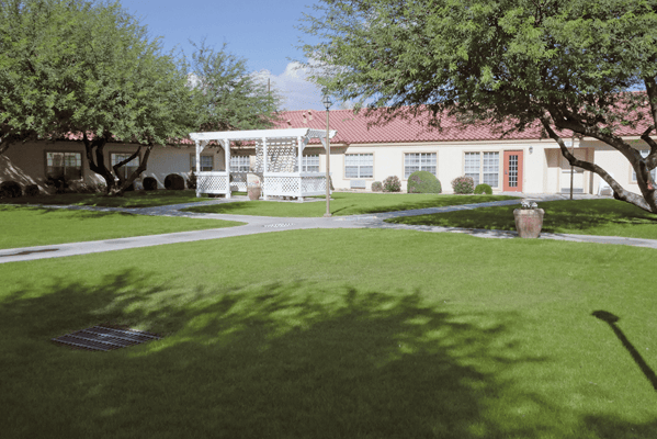 A well-maintained outdoor space with a gazebo and lush lawn