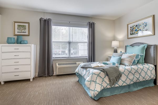 Brightly decorated private resident room with natural light