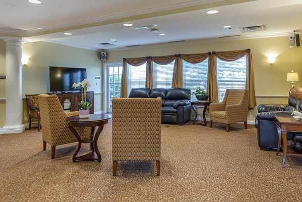 Common area with seating and a large TV