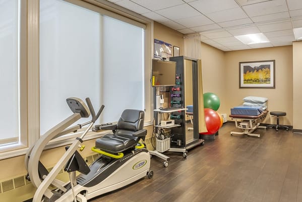 Well-equipped therapy room with exercise equipment