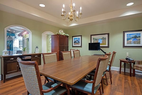 Bright dining area with a large table and chairs