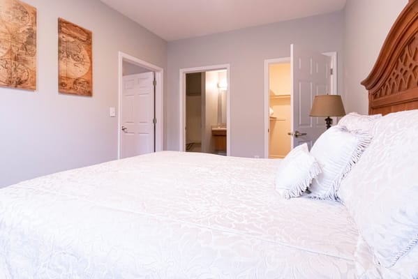 Cozy resident room with a bed and artwork