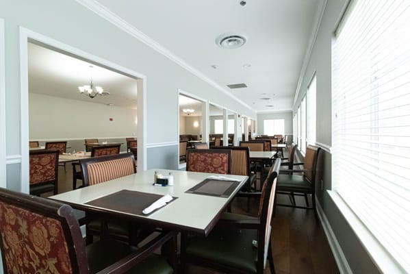 Interior view of a dining area with tables and chairs