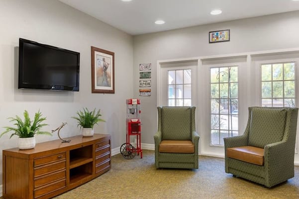 Bright common area with seating and plants