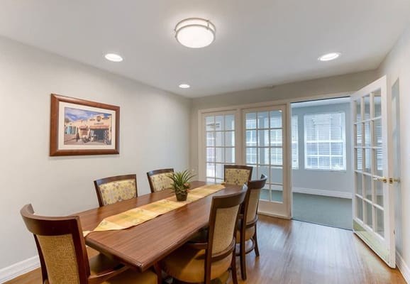 Interior dining room with a wooden table and chairs